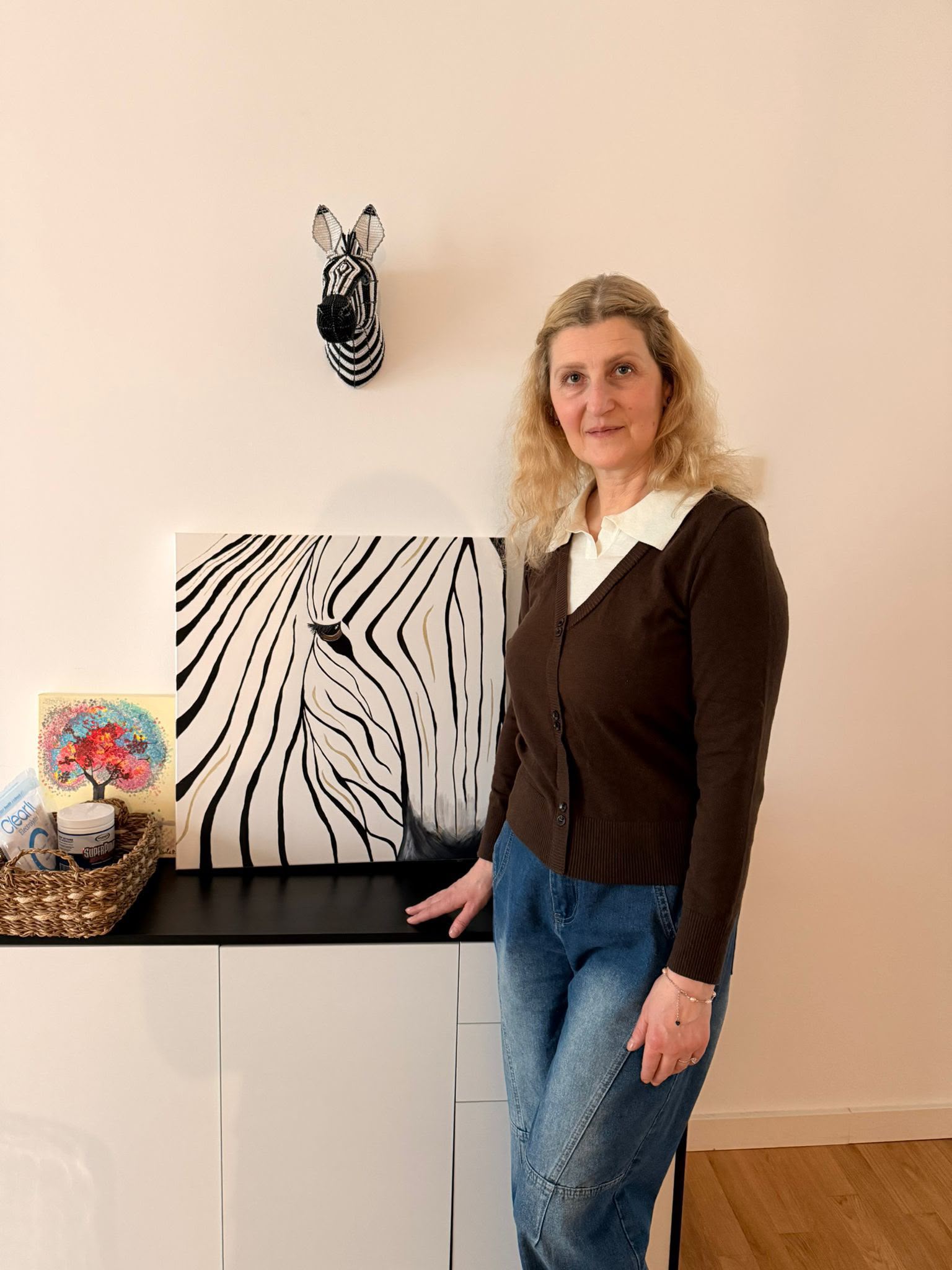 Mirela beside her zebra painting